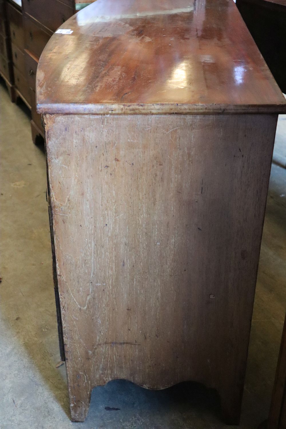 A Regency mahogany bowfronted chest of three graduated long drawers, width 113cm